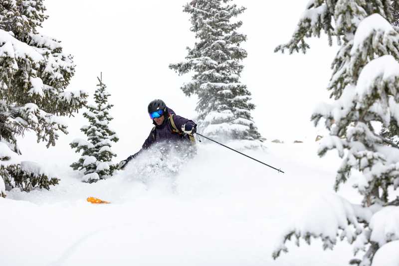 Me skiing in powder and trees